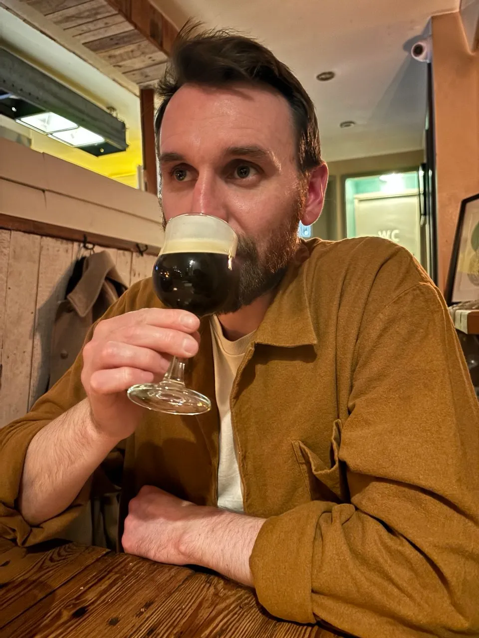 Peter drinking an Irish coffee